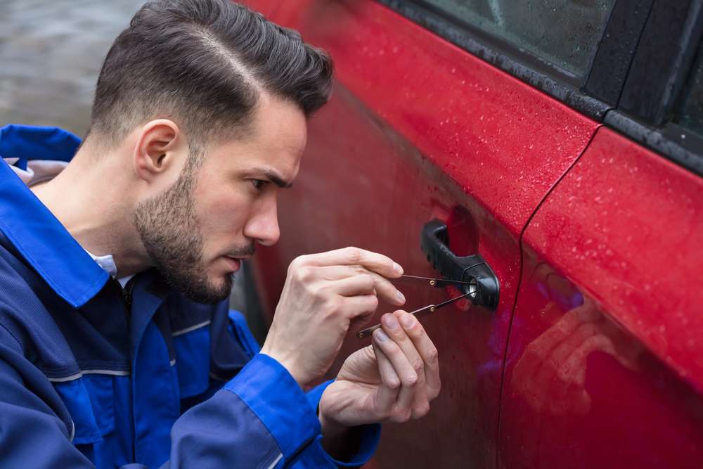Car locksmith at a vehicle